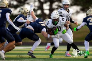 Millard West runningback David Washington (20) is tackled by Elkhorn South player Isaac Pemberton (11) during a high school football game, Friday, October 31, 2025, Omaha, Nebraska. Photo by Braden Cochran.