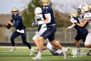 Elkhorn South quarterback Luke Valasek (2) runs to the near sideline while looking for a target during a high school football game, Friday, October 31, 2025, Omaha, Nebraska. Photo by Braden Cochran.