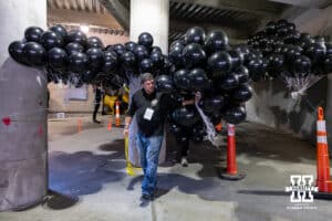 Black balloons being prepared for the Black Out game before the college football game between the Nebraska Cornhuskers and the Southern California Trojans on Saturday, November 1, 2025, in Lincoln, Nebraska. Photo by John S. Peterson.