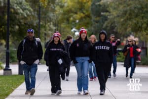Nebraska Cornhusker fan walking to the stadium before the college football game against the Southern California Trojans on Saturday, November 1, 2025, in Lincoln, Nebraska. Photo by John S. Peterson.