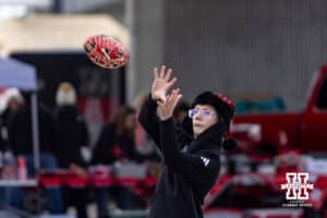 Nebraska Cornhusker fan playing catch before the college football game against the Southern California Trojans on Saturday, November 1, 2025, in Lincoln, Nebraska. Photo by John S. Peterson.