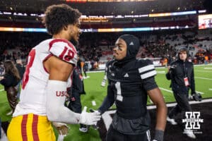 Nebraska Cornhusker defensive back Ceyair Wright (1) shakes hands with a former teammate Southern California Trojan tight end Joey Olsen (18) during a college football game on Saturday, November 1, 2025, in Lincoln, Nebraska. Photo by John S. Peterson.