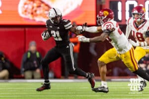 Nebraska Cornhusker running back Emmett Johnson (21) runs with the ball against Southern California Trojan linebacker Desman Stephens II (23) in the fourth quarter during a college football game on Saturday, November 1, 2025, in Lincoln, Nebraska. Photo by John S. Peterson.