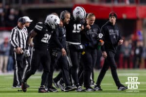 Nebraska Cornhusker quarterback Dylan Raiola (15) was helped off the field after being injured in the third quarter during a college football game on Saturday, November 1, 2025, in Lincoln, Nebraska. Photo by John S. Peterson.