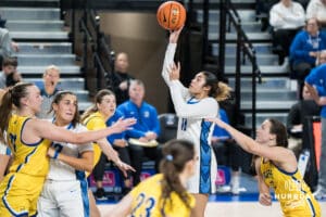 Creighton Bluejay Kiani Lockett (#11) shoots over defenders during a basketball game against South Dakota State on Monday, November 3, 2025, in Omaha, Nebraska. Photo by Brandon Tiedemann.