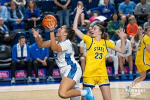 Creighton Bluejay Grace Boffeli (#42) shoots past the defender during a basketball game against South Dakota State on Monday, November 3, 2025, in Omaha, Nebraska. Photo by Brandon Tiedemann.