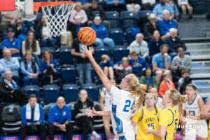 Creighton Bluejay Ava Zediker (#24) sneaks by defenders during a basketball game against South Dakota State on Monday, November 3, 2025, in Omaha, Nebraska. Photo by Brandon Tiedemann.