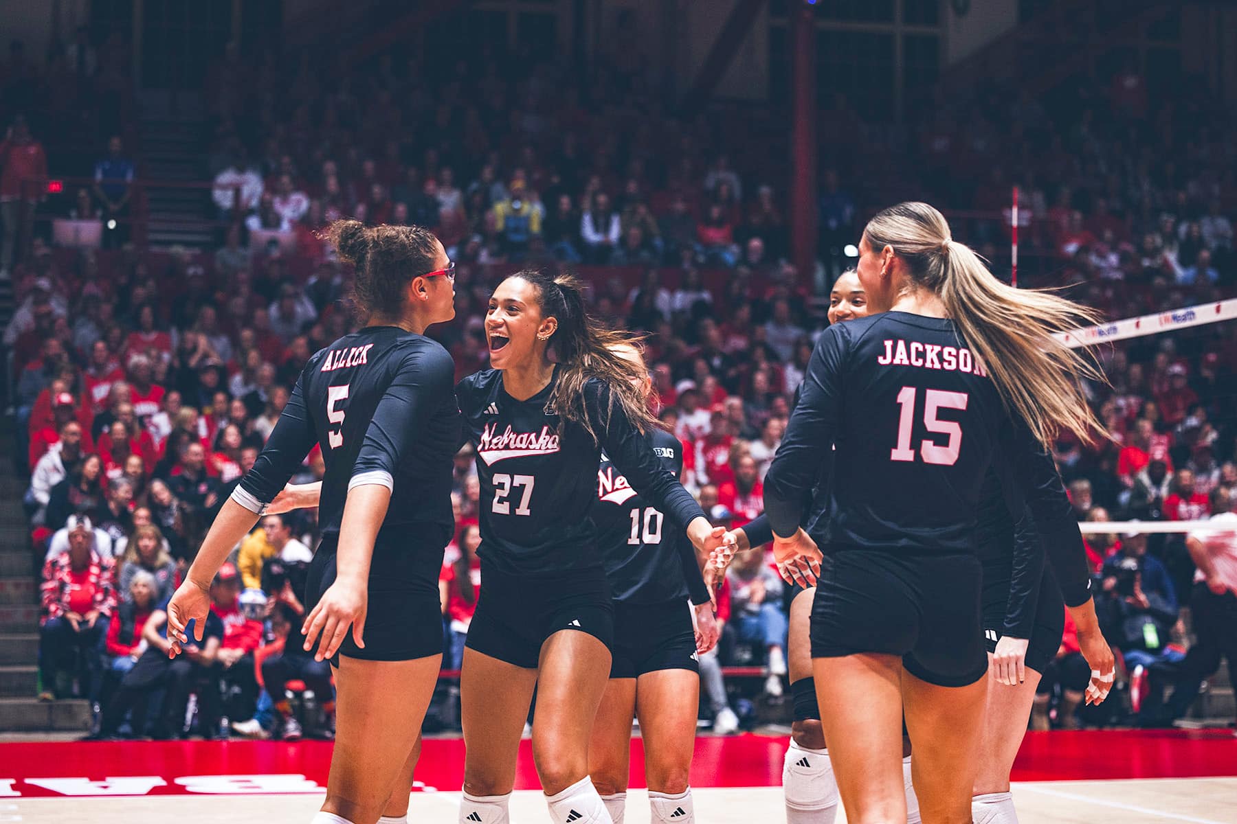 Nebraska Cornhusker Harper Murray (27) celebrates a kill with Rebekka Allick (5) against the Wisconsin Badgers during a college volleyball match on Friday, October 31, 2025, in Madison, Wisconsin. Photo NU Athletics.