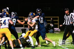 Wahoo's Brody Milliken (16) getting tackled during a high school football game at Concordia on Friday, October 24, 2025 in Omaha, Nebraska. Photo By Jack Stephens.