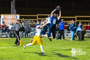 Concordia's Elijah Carlson (8) is catching a touchdown pass during a high school football game against Wahoo on Friday, October 24, 2025 in Omaha, Nebraska. Photo By Jack Stephens.