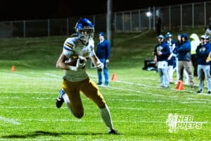 Wahoo's Cody Hesser (15) is running into the end zone for a touchdown during a high school football game at Concordia on Friday, October 24, 2025 in Omaha, Nebraska. Photo By Jack Stephens.