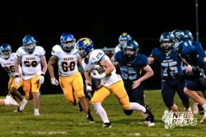 Wahoo's Kip Brigham (32) running through traffic to score a rushing touchdown during a high school football game at Concordia on Friday, October 24, 2025 in Omaha, Nebraska. Photo By Jack Stephens.