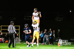 Wahoo's Harrison Krueger (31) is lifting up his teammate Kip Brigham (32) after he scored a rushing touchdown during a high school football game at Concordia on Friday, October 24, 2025 in Omaha, Nebraska. Photo By Jack Stephens.