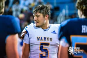 Wahoo's Eli Shada (5) is looking at the ref before he flips the coin during the coin toss before a high school football game at Concordia on Friday, October 24, 2025 in Omaha, Nebraska. Photo By Jack Stephens.