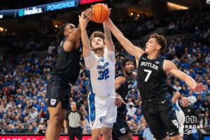 Creighton Bluejay Owen Freeman (32) looks to grab a rebound over Michael Ajayi (5) and Jamie Kaiser Jr. (7) during a basketball game against Butler on Tuesday, Dec 30, 2025, in Omaha, Nebraska. Photo by Brandon Tiedemann.