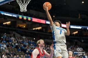 Creighton Bluejay Austin Swartz (1) attempts a lay up during a basketball game against Utah Tech on Monday, Dec 22, 2025, in Omaha, Nebraska. Photo by Brandon Tiedemann.