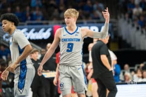 Creighton Bluejay Ty Davis (9) hypes up the crowd during a basketball game against Utah Tech on Monday, Dec 22, 2025, in Omaha, Nebraska. Photo by Brandon Tiedemann.