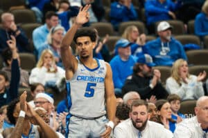 Creighton Bluejay Nik Graves (5) celebrates a three pointer during a basketball game against Utah Tech on Monday, Dec 22, 2025, in Omaha, Nebraska. Photo by Brandon Tiedemann.