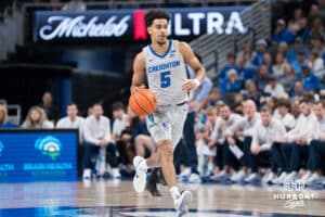 Creighton Bluejay Nik Graves (5) takes the ball up the court during a basketball game against Utah Tech on Monday, Dec 22, 2025, in Omaha, Nebraska. Photo by Brandon Tiedemann.