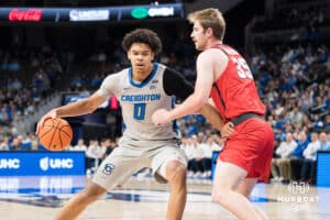 Creighton Bluejay Jasen Green (0) backs down a defender during a basketball game against Utah Tech on Monday, Dec 22, 2025, in Omaha, Nebraska. Photo by Brandon Tiedemann.