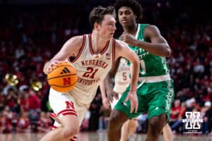 Nebraska Cornhusker forward Pryce Sandfort (21) drive to the basket against North Dakota Fighting Hawk forward Marley Curtis (0) in the second half during a college basketball game on Sunday, Dec. 21, 2025, in Lincoln, Nebraska. Photo by John S. Peterson.