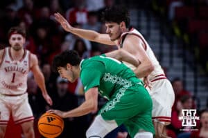 Nebraska Cornhusker forward Berke Büyüktuncel (9) defends against North Dakota Fighting Hawk forward George Natsvlishvili (13) in the second half during a college basketball game on Sunday, Dec. 21, 2025, in Lincoln, Nebraska. Photo by John S. Peterson.