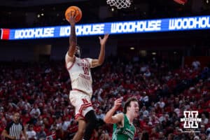 Nebraska Cornhusker guard Jamarques Lawrence (10) makes a lay up against North Dakota Fighting Hawk guard Greyson Uelmen (3) in the second half during a college basketball game on Sunday, Dec. 21, 2025, in Lincoln, Nebraska. Photo by John S. Peterson.