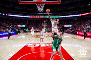 Nebraska Cornhusker guard Jamarques Lawrence (10) makes a lay up against North Dakota Fighting Hawk guard Greyson Uelmen (3) in the second half during a college basketball game on Sunday, Dec. 21, 2025, in Lincoln, Nebraska. Photo by John S. Peterson.