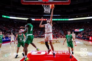 Nebraska Cornhusker forward Berke Büyüktuncel (9) makes a lay up against North Dakota Fighting Hawk forward Marley Curtis (0) in the second half during a college basketball game on Sunday, Dec. 21, 2025, in Lincoln, Nebraska. Photo by John S. Peterson.