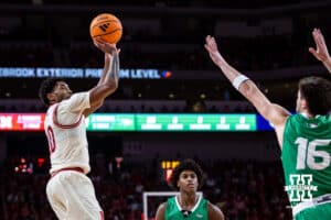 Nebraska Cornhusker guard Jamarques Lawrence (10) makes three point shot against North Dakota Fighting Hawk guard Garrett Anderson (16) in the second half during a college basketball game on Sunday, Dec. 21, 2025, in Lincoln, Nebraska. Photo by John S. Peterson.