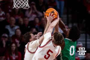 Nebraska Cornhusker guard Cale Jacobsen (31) and forward Braden Frager (5) go after the rebound against North Dakota Fighting Hawk forward Marley Curtis (0) in the second half during a college basketball game on Sunday, Dec. 21, 2025, in Lincoln, Nebraska. Photo by John S. Peterson.