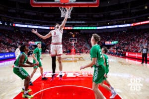Nebraska Cornhusker forward Berke Büyüktuncel (9) tip the ball in the basket from guard Jamarques Lawrence (10) shot during a college basketball game on Sunday, Dec. 21, 2025, in Lincoln, Nebraska. Photo by John S. Peterson.