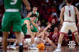 Nebraska Cornhusker forward Pryce Sandfort (21) and North Dakota Fighting Hawk guard Greyson Uelmen (3) scramble for the ball in tthe second first half during a college basketball game on Sunday, Dec. 21, 2025, in Lincoln, Nebraska. Photo by John S. Peterson.