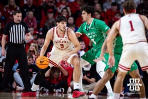Nebraska Cornhusker forward Berke Büyüktuncel (9) dribbles the ball against North Dakota Fighting Hawk forward George Natsvlishvili (13) in the first half during a college basketball game on Sunday, Dec. 21, 2025, in Lincoln, Nebraska. Photo by John S. Peterson.