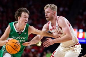 Nebraska Cornhusker forward Rienk Mast (51) guards against North Dakota Fighting Hawk guard Greyson Uelmen (3) in the first half during a college basketball game on Sunday, Dec. 21, 2025, in Lincoln, Nebraska. Photo by John S. Peterson.