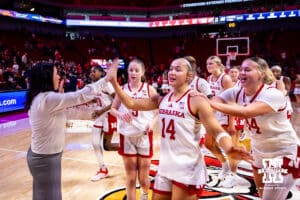 Nebraska Cornhusker guard Callin Hake (14) high fiving Amy Williams after the win over California Baptist Lancers during a college basketball game on Sunday, Dec. 21, 2025, in Lincoln, Nebraska. Photo by John S. Peterson.