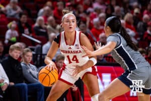 Nebraska Cornhusker guard Callin Hake (14) dribbles the ball against the California Baptist Lancers in the second set during a college basketball game on Sunday, Dec. 21, 2025, in Lincoln, Nebraska. Photo by John S. Peterson.