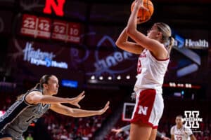 Nebraska Cornhusker forward Jessica Petrie (12) makes a basket in the second quarter against California Baptist Lancer forward Emma Johansson (14) during a college basketball game on Sunday, Dec. 21, 2025, in Lincoln, Nebraska. Photo by John S. Peterson