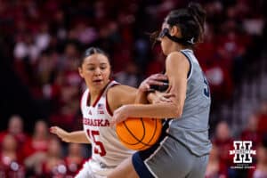 Nebraska Cornhusker guard Kennadi Williams (15) reaches for the ball against California Baptist Lancer guard Filipa Barros (5) in the first quarter during a college basketball game on Sunday, Dec. 21, 2025, in Lincoln, Nebraska. Photo by John S. Peterson.
