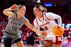 Nebraska Cornhusker guard Logan Nissley (2) drives the baseline against California Baptist Lancer guard Chance Bucher (10) in the first quarter during a college basketball game on Sunday, Dec. 21, 2025, in Lincoln, Nebraska. Photo by John S. Peterson.