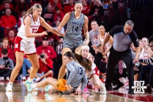 Nebraska Cornhusker guard Britt Prince (23) goes after the ball against California Baptist Lancer guard Lauren Olsen (13) in the first quarter during a college basketball game on Sunday, Dec. 21, 2025, in Lincoln, Nebraska. Photo by John S. Peterson.