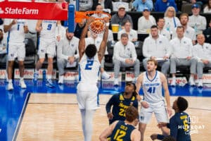 Creighton's Blake Harper dunks the basketball. Creighton men's basketball hosts Marquette at CHI Health Center on Saturday, Dec 20, 2025, in Omaha, Nebraska. Photo by Kyle Byers.