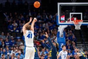 Creighton's Isaac Traudt attempts a three-point shot. Creighton men's basketball hosts Marquette at CHI Health Center on Saturday, Dec 20, 2025, in Omaha, Nebraska. Photo by Kyle Byers.
