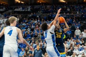 Creighton's Jasen Green defends against a lay up attempt by Michael Phillips II. Creighton men's basketball hosts Marquette at CHI Health Center on Saturday, Dec 20, 2025, in Omaha, Nebraska. Photo by Kyle Byers.