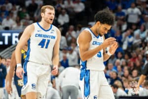 Creighton's Isaac Traudt celebrates with Nik Graves. Creighton men's basketball hosts Marquette at CHI Health Center on Saturday, Dec 20, 2025, in Omaha, Nebraska. Photo by Kyle Byers.