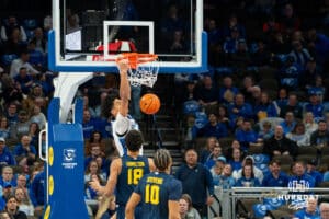 Creighton's Jasen Green dunks the basketball. Creighton men's basketball hosts Marquette at CHI Health Center on Saturday, Dec 20, 2025, in Omaha, Nebraska. Photo by Kyle Byers.
