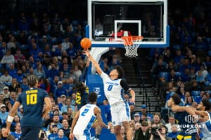 Creighton's Jasen Green blocks a layup attempted by Marquette's Sean Jones. Creighton men's basketball hosts Marquette at CHI Health Center on Saturday, Dec 20, 2025, in Omaha, Nebraska. Photo by Kyle Byers.