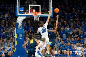 Creighton's Owen Freeman defends the basket against Marquette's Joshua Clark. Creighton men's basketball hosts Marquette at CHI Health Center on Saturday, Dec 20, 2025, in Omaha, Nebraska. Photo by Kyle Byers.