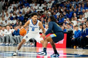 Creighton's Nik Graves dribbles the ball. Creighton men's basketball hosts Marquette at CHI Health Center on Saturday, Dec 20, 2025, in Omaha, Nebraska. Photo by Kyle Byers.