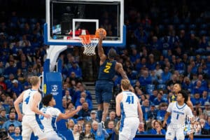 Marquette's Chase Ross dunks the basketball. Creighton men's basketball hosts Marquette at CHI Health Center on Saturday, Dec 20, 2025, in Omaha, Nebraska. Photo by Kyle Byers.